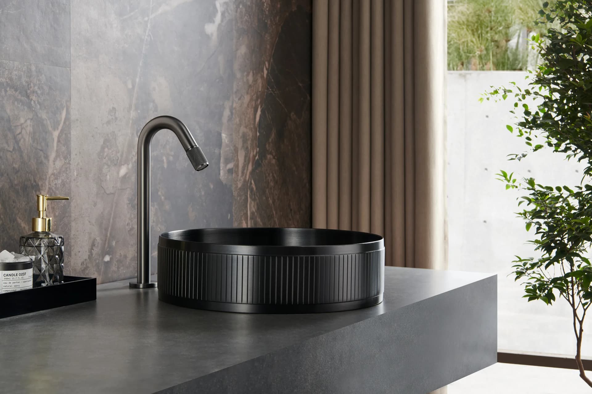 Basin lit against dark stone