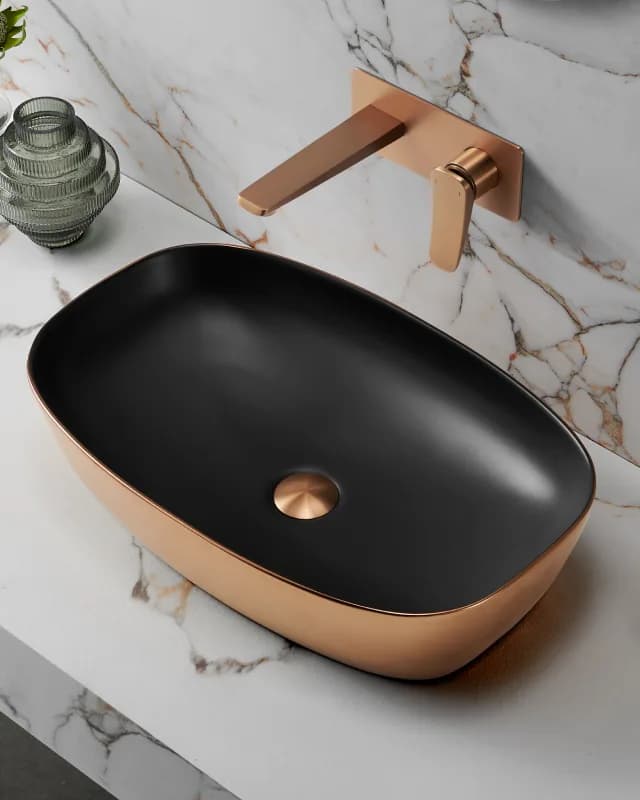 Marble basins on a stone vanity